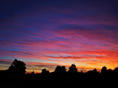 Colourful start to the day with beautiful streak of colours from the rising highlighting the clouds and the sky