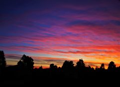 Colourful start to the day with beautiful streak of colours from the rising highlighting the clouds and the sky