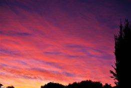 Colourful start to the day with beautiful streak of colours from the rising highlighting the clouds and the sky