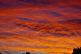 Colourful start to the day with beautiful streak of colours from the rising highlighting the clouds and the sky