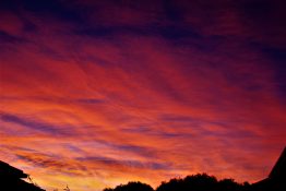 Colourful start to the day with beautiful streak of colours from the rising highlighting the clouds and the sky