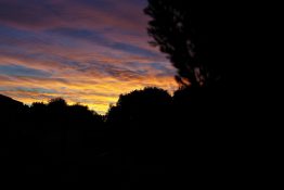 Colourful start to the day with beautiful streak of colours from the rising highlighting the clouds and the sky