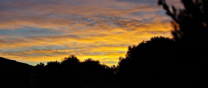 Colourful start to the day with beautiful streak of colours from the rising highlighting the clouds and the sky