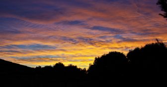 Colourful start to the day with beautiful streak of colours from the rising highlighting the clouds and the sky