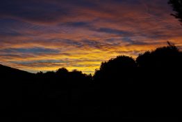 Colourful start to the day with beautiful streak of colours from the rising highlighting the clouds and the sky