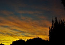 Colourful start to the day with beautiful streak of colours from the rising highlighting the clouds and the sky