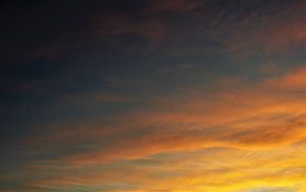 Colourful start to the day with beautiful streak of colours from the rising highlighting the clouds and the sky