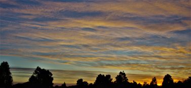 Colourful start to the day with beautiful streak of colours from the rising highlighting the clouds and the sky