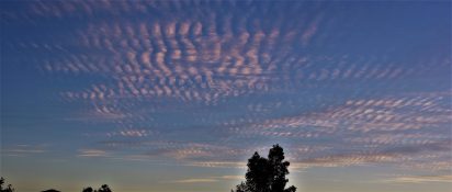 Colourful start to the day with beautiful streak of colours from the rising highlighting the clouds and the sky