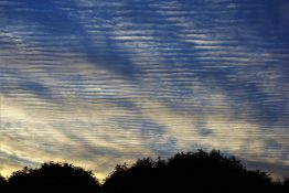 Colourful start to the day with beautiful streak of colours from the rising highlighting the clouds and the sky