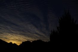 Colourful start to the day with beautiful streak of colours from the rising highlighting the clouds and the sky