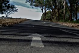 Arrow markings painted on the road to indicate the direction of traffic