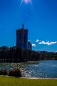 Apartment building under construction near a man made pond