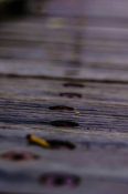 Close up of a wooden bridges showing aged conditions of the planks and nuts