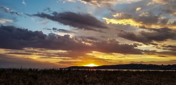 Beautiful sunset at Lake Taupou in New Zealand.