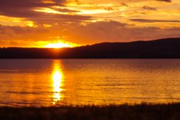 Magnificent golden sunset at Lake Taupou - New Zealand