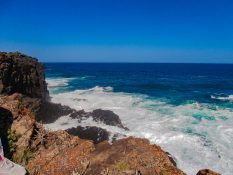 Huge waves crashing on the retainers in Kiama