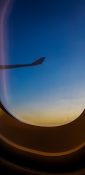 Beautiful evening view from a planes window as it cruises over the clouds