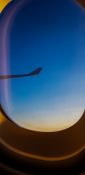 Beautiful evening view from a planes window as it cruises over the clouds