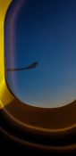 Beautiful evening view from a planes window as it cruises over the clouds