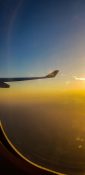 Beautiful evening view from a planes window as it cruises over the clouds