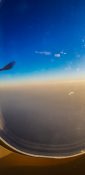 Beautiful evening view from a planes window as it cruises over the clouds