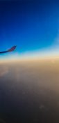 Beautiful evening view from a planes window as it cruises over the clouds