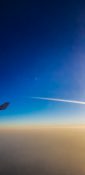 Beautiful evening view from a planes window as it cruises over the clouds