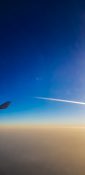 Beautiful evening view from a planes window as it cruises over the clouds