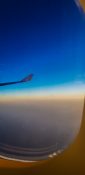 Beautiful evening view from a planes window as it cruises over the clouds