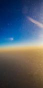 Beautiful evening view from a planes window as it cruises over the clouds