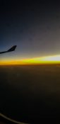 Beautiful evening view from a planes window as it cruises over the clouds