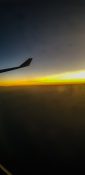 Beautiful evening view from a planes window as it cruises over the clouds