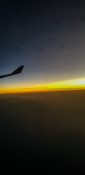 Beautiful evening view from a planes window as it cruises over the clouds