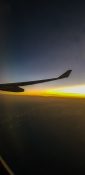 Beautiful evening view from a planes window as it cruises over the clouds