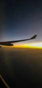 Beautiful evening view from a planes window as it cruises over the clouds