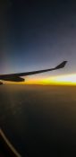 Beautiful evening view from a planes window as it cruises over the clouds