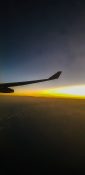 Beautiful evening view from a planes window as it cruises over the clouds