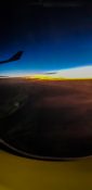 Beautiful evening view from a planes window as it cruises over the clouds