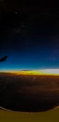 Beautiful evening view from a planes window as it cruises over the clouds