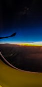 Beautiful evening view from a planes window as it cruises over the clouds