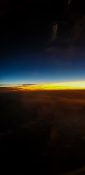 Beautiful evening view from a planes window as it cruises over the clouds