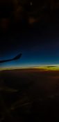 Beautiful evening view from a planes window as it cruises over the clouds