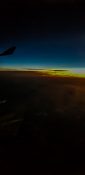 Beautiful evening view from a planes window as it cruises over the clouds