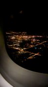 Night view of Auckland as plane descends to land at the airport