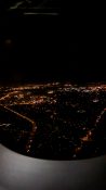 Night view of Auckland as plane descends to land at the airport