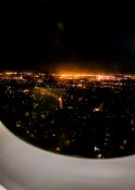 Night view of Auckland as plane descends to land at the airport