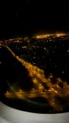 Night view of Auckland as plane descends to land at the airport