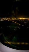 Night view of Auckland as plane descends to land at the airport