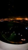 Night view of Auckland as plane descends to land at the airport